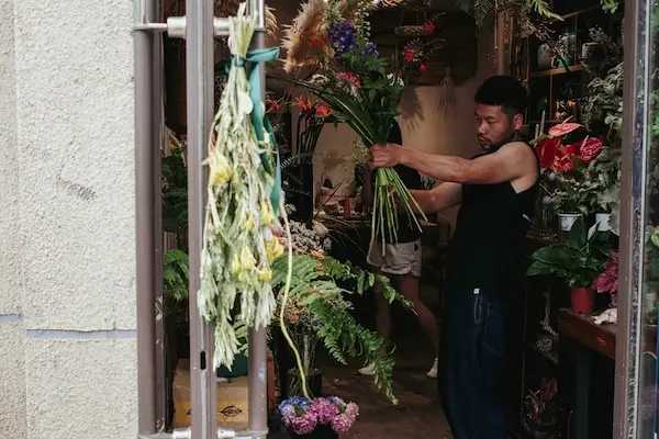 Florist arranging wedding flowers